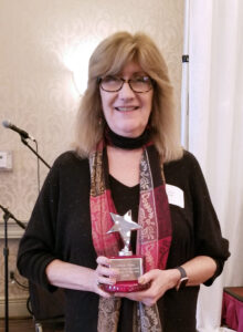 Laura Vear receiving the Parent Support Network's Peer Recovery Specialist Supervisor of the Year Award 