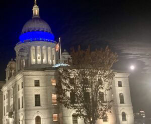 RI State House dome is lit blue for Child Abuse Prevention Month.