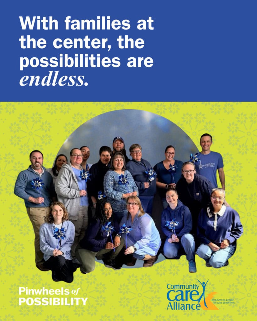 FCCP Team posing together with pinwheels in hand. Text above reads, "With Families at the Center, the Possibilities are Endless"