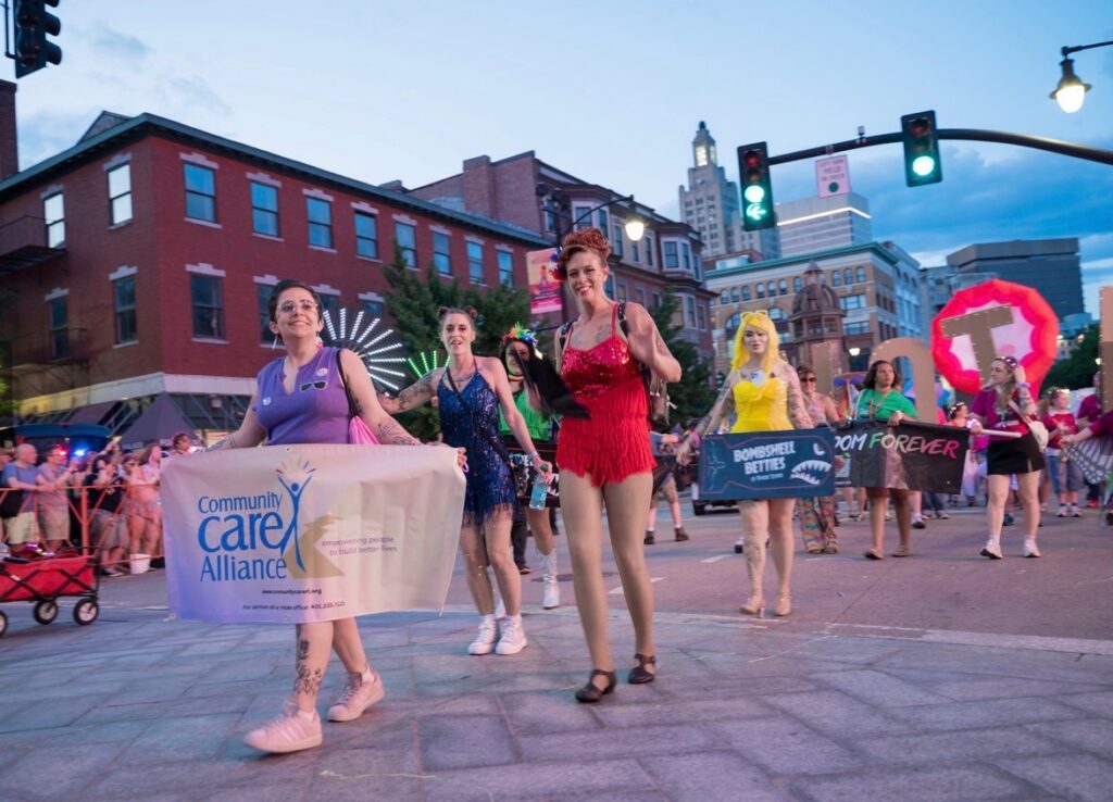 CCA staff holding banner in Pride Parade in Providence